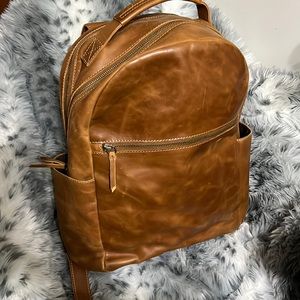 Unisex leather backpack.. absolutely fantastic just purging closets.